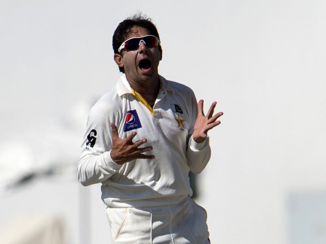 Saeed Ajmal reacts after taking a wicket. Ajmal grabbed four wickets in South Africa's second innnings. PHOTO: AFP