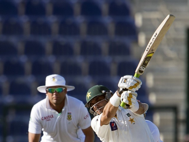 Pakistan captain Misbahul Haq (R) smashed a majestic six to complete his team's victory over South Africa in the first Test at the Sheikh Zayed Cricket Stadium in Abu Dhabi on October 17, 2013. PHOTO: AFP